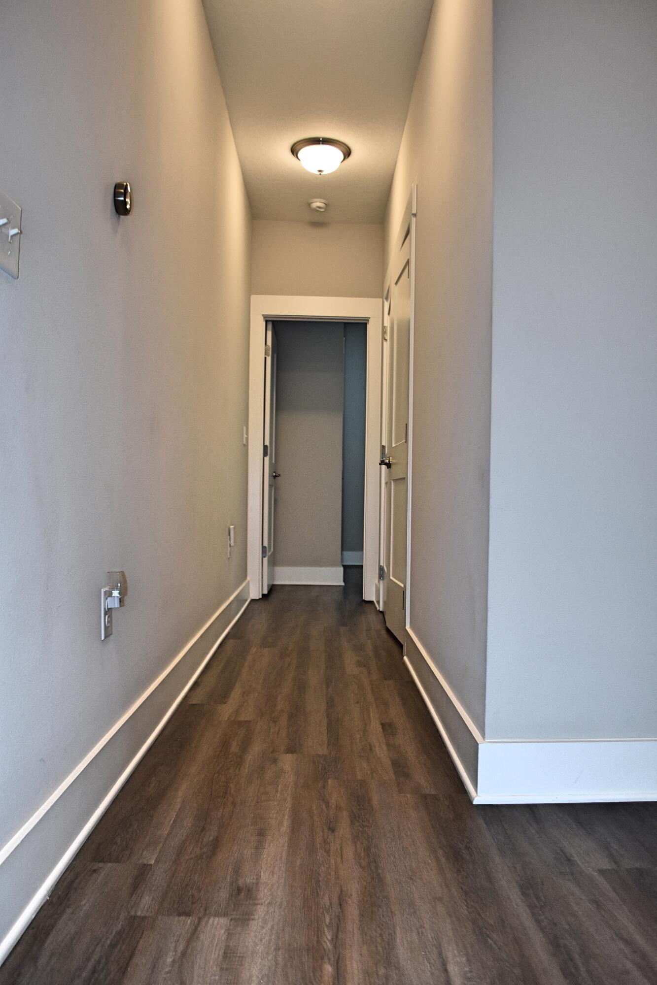 242 North Sand Palm Road Freeport, FL 32439 - Photo 11 of 34 an empty room with wooden floor and closet