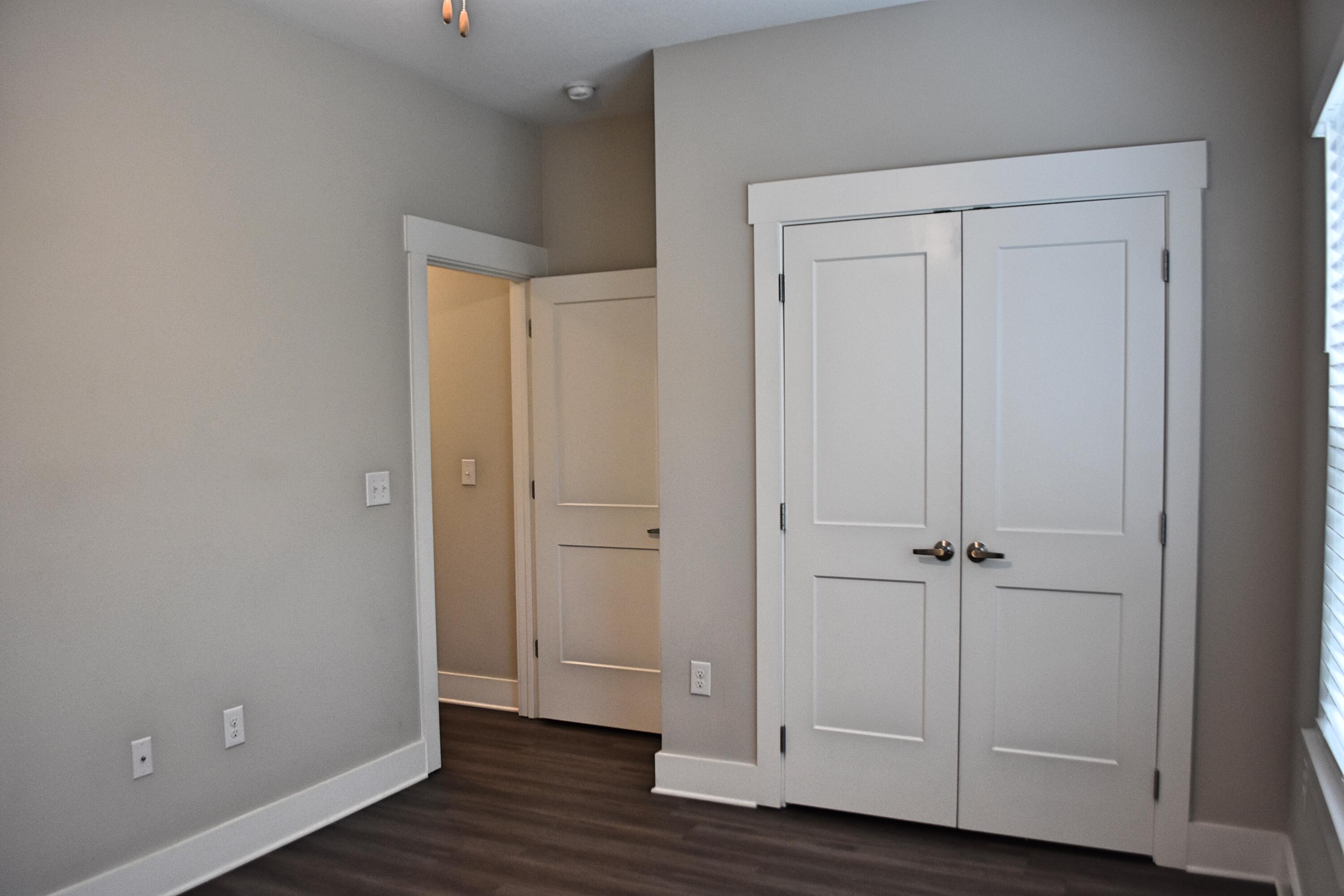242 North Sand Palm Road Freeport, FL 32439 - Photo 15 of 34 an empty room with wooden floor