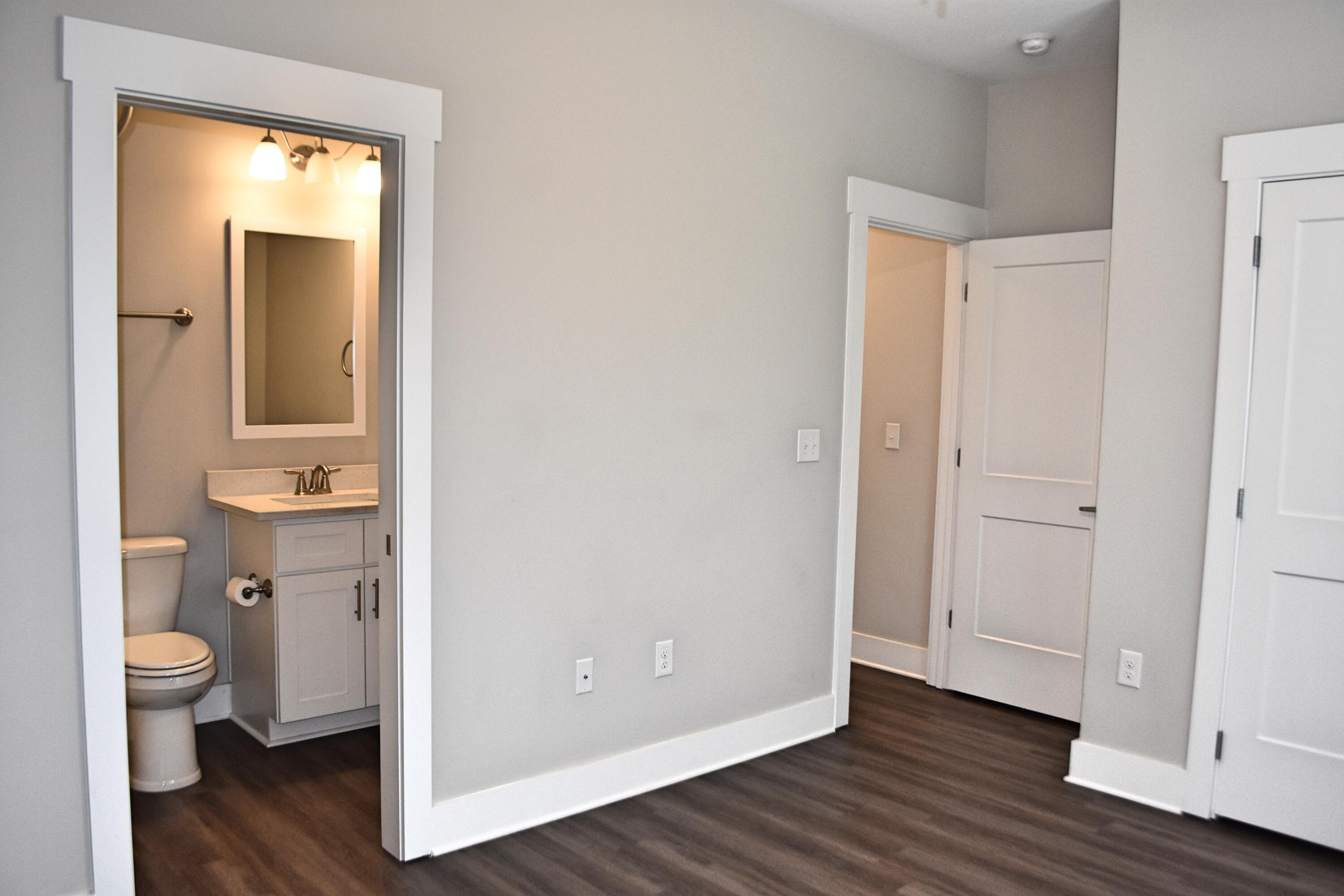 242 North Sand Palm Road Freeport, FL 32439 - Photo 16 of 34 a view of bathroom with a toilet sink and a mirror
