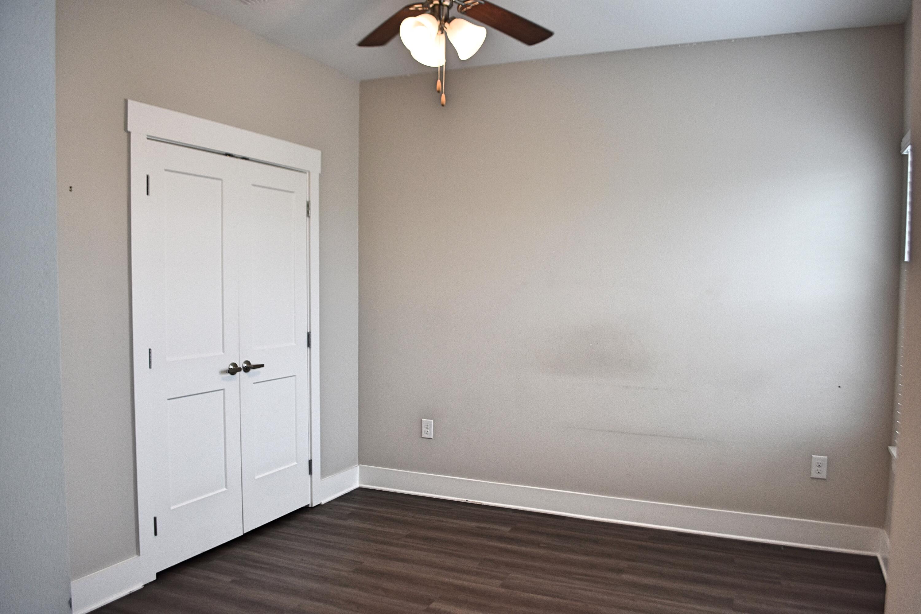 242 North Sand Palm Road Freeport, FL 32439 - Photo 20 of 34 a view of an empty room with wooden floor