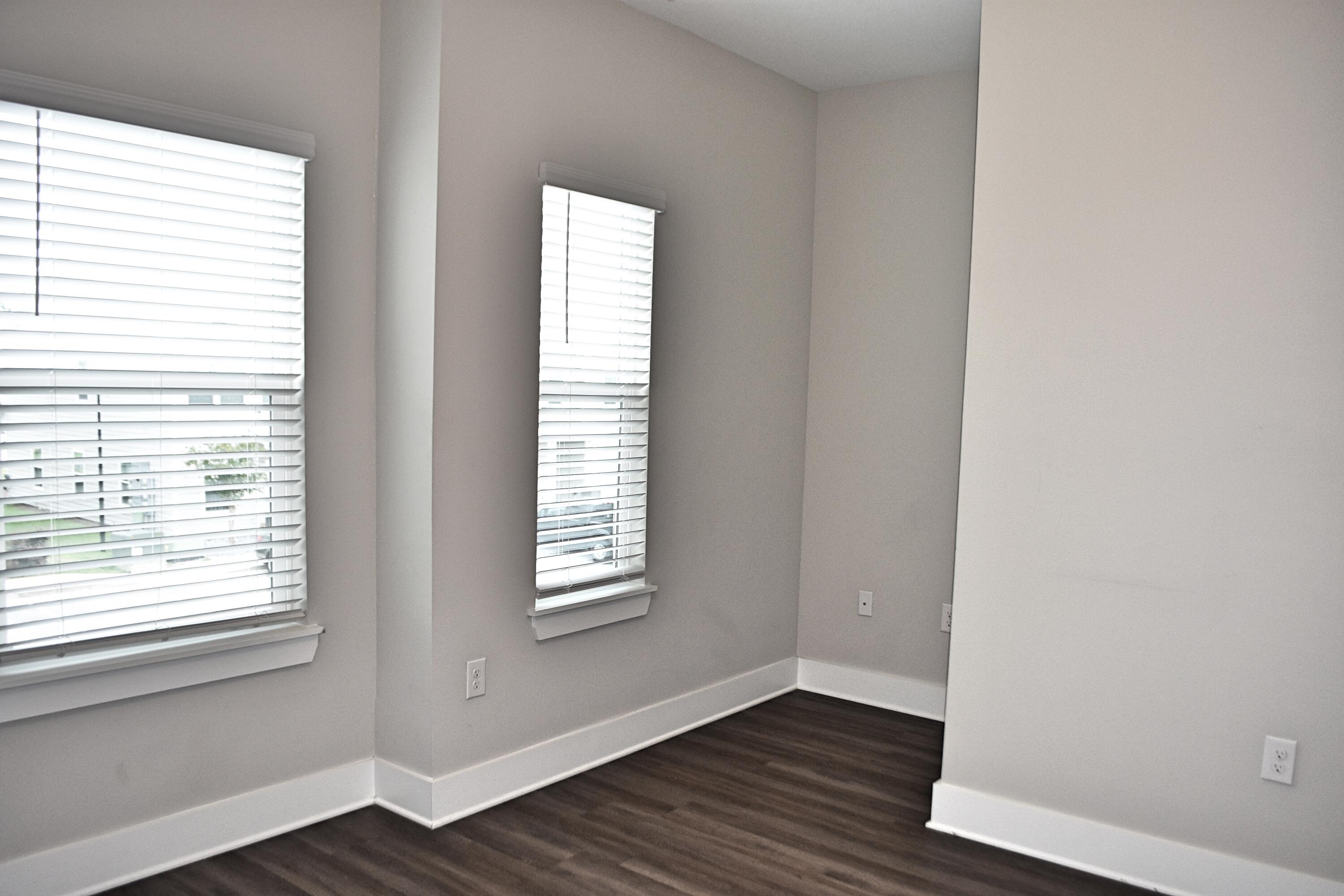242 North Sand Palm Road Freeport, FL 32439 - Photo 21 of 34 a view of an empty room with wooden floor and a window