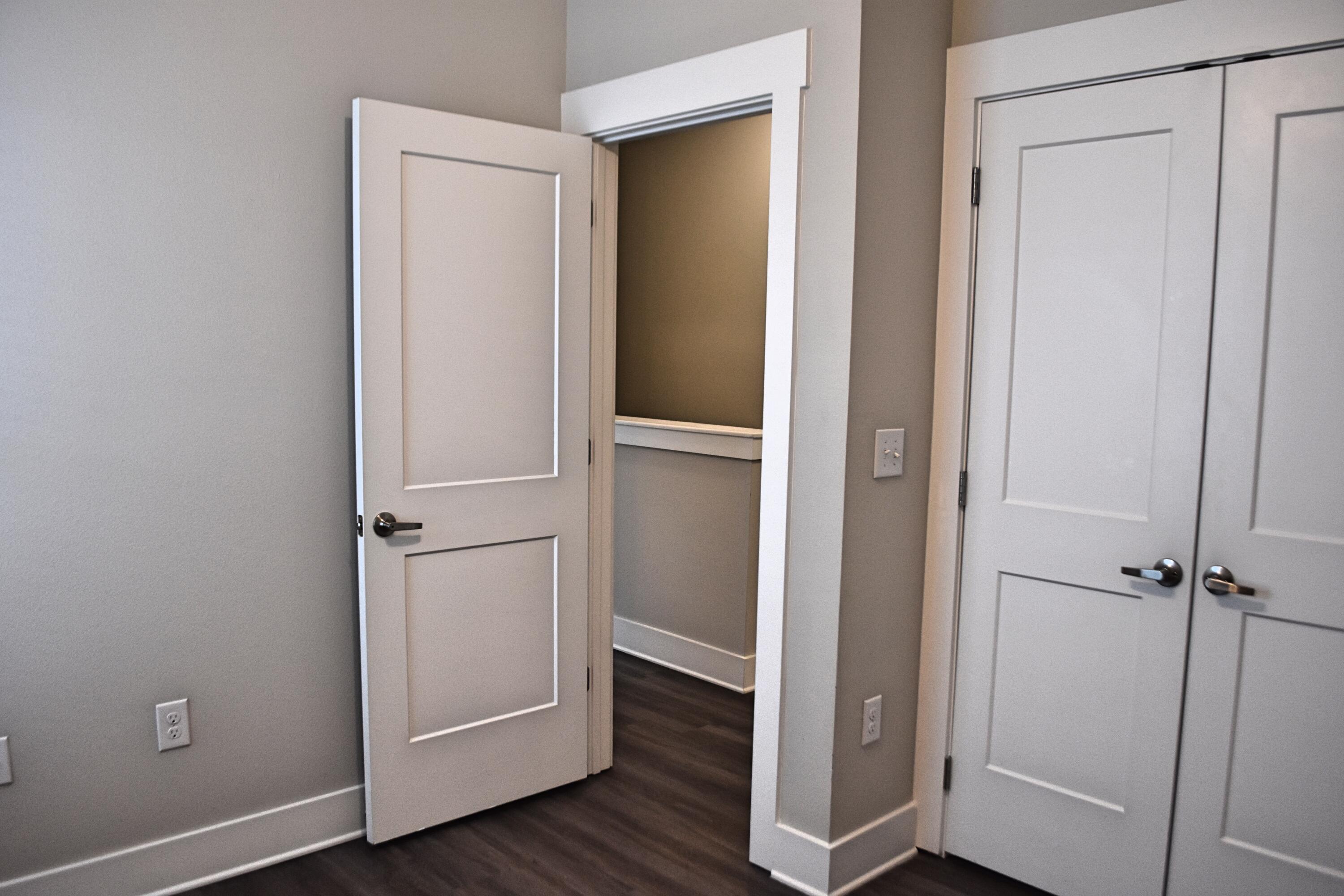 242 North Sand Palm Road Freeport, FL 32439 - Photo 25 of 34 a view of an empty room with wooden floor and closet