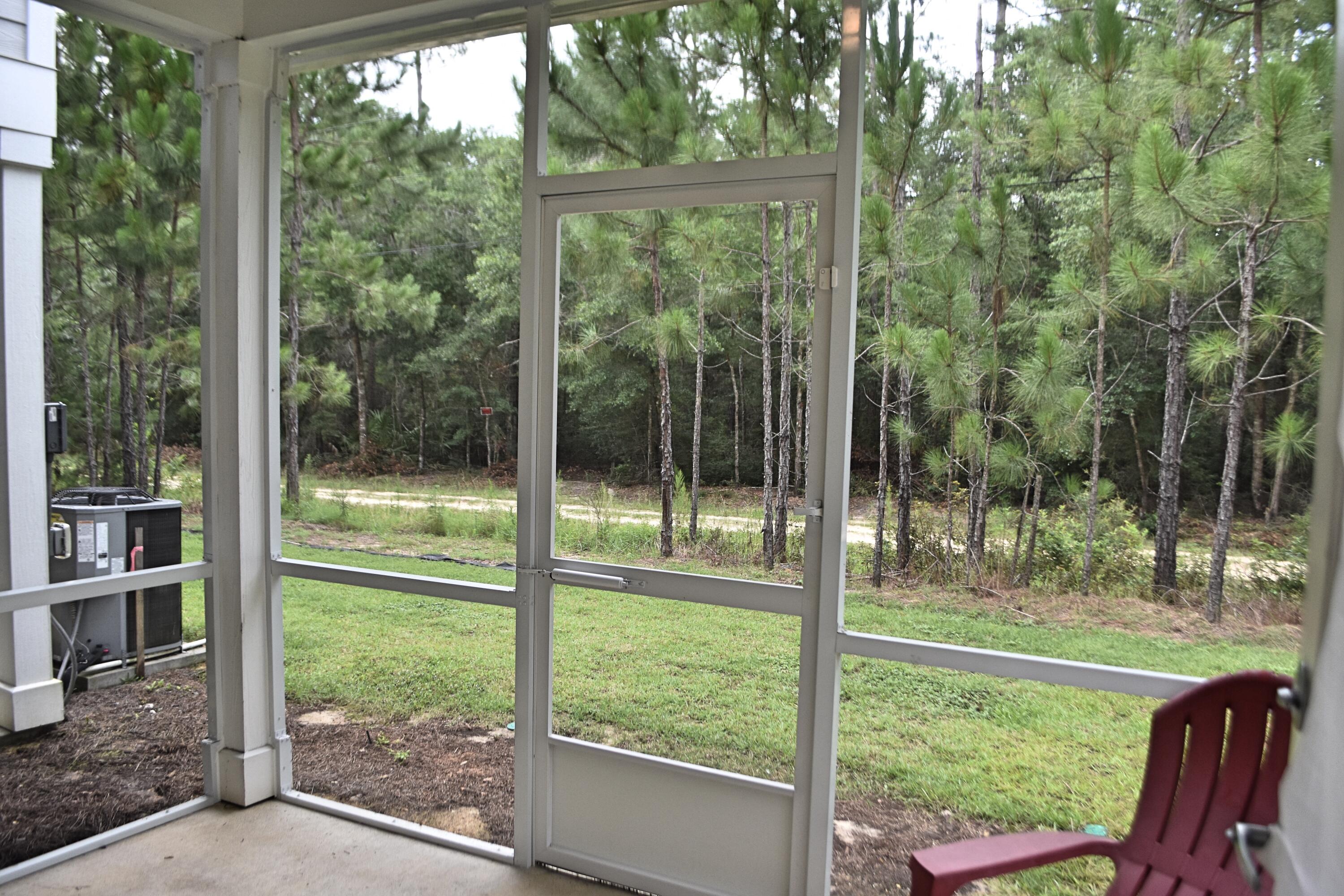 242 North Sand Palm Road Freeport, FL 32439 - Photo 27 of 34 a view of outdoor space with backyard