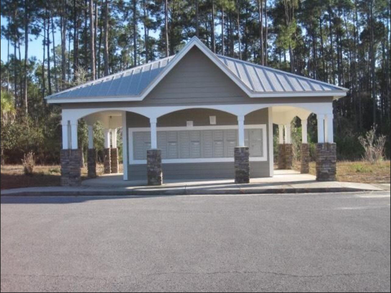 242 North Sand Palm Road Freeport, FL 32439 - Photo 31 of 34 front view of a house with a porch