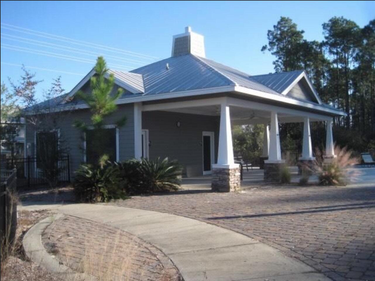 242 North Sand Palm Road Freeport, FL 32439 - Photo 32 of 34 a front view of a house with garden