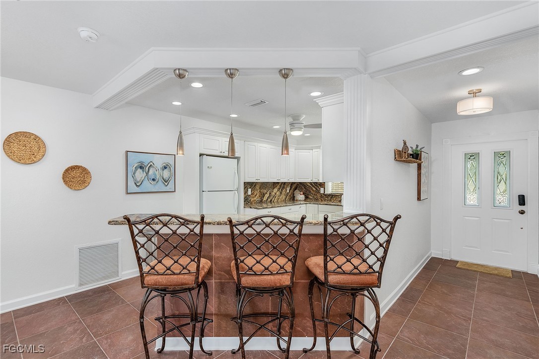 1120 Southeast 46th Street, Unit 2B Cape Coral, FL 33904 - Photo 11 of 26 a view of a dining room with furniture