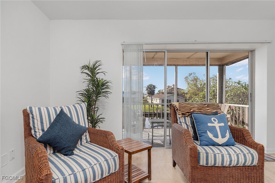1120 Southeast 46th Street, Unit 2B Cape Coral, FL 33904 - Photo 12 of 26 a living room with furniture and a potted plant