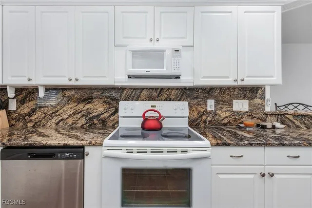 a stove top oven sitting inside of a kitchen