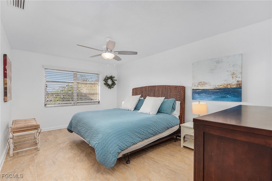 1120 Southeast 46th Street, Unit 2B Cape Coral, FL 33904 - Photo 14 of 26 a bedroom with a bed and window