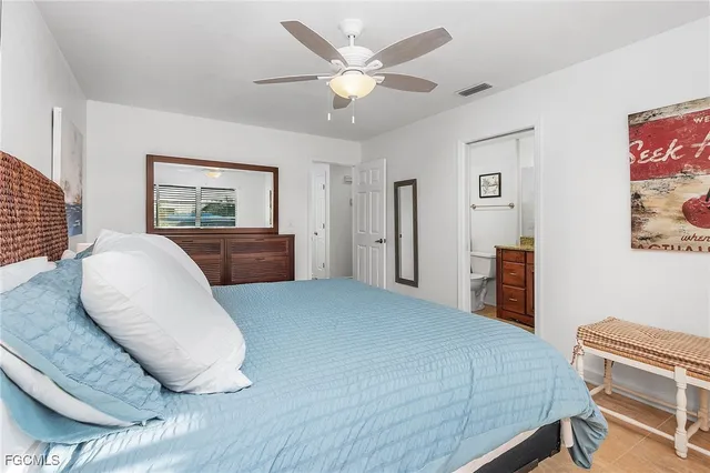 a bedroom with a large bed and furniture