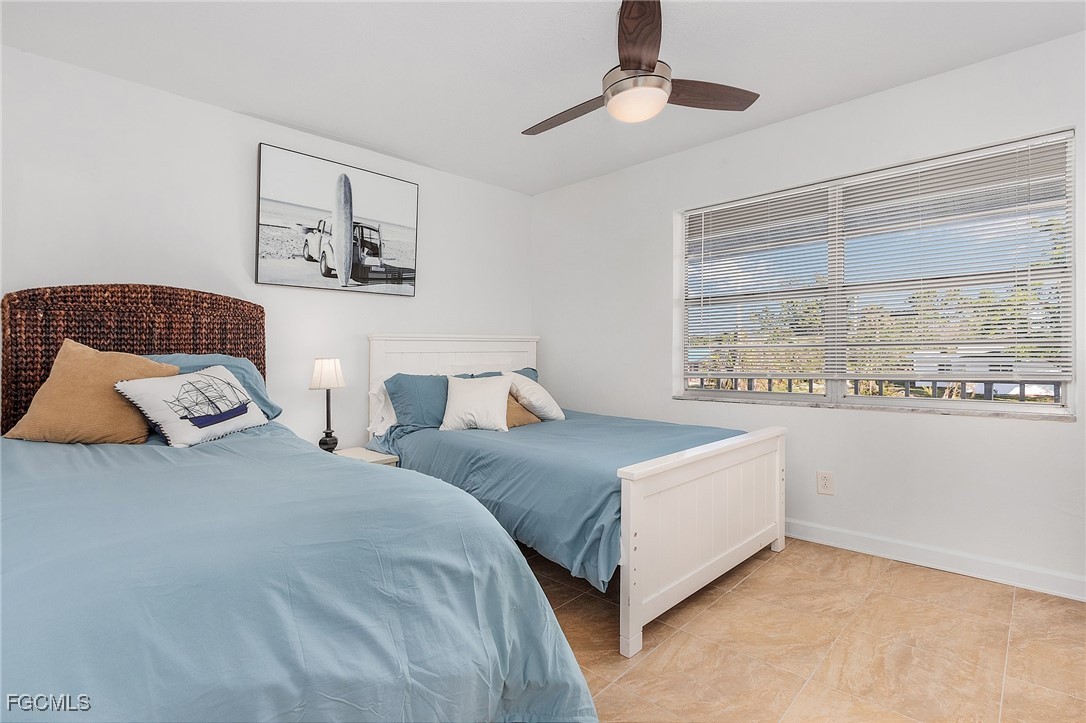 1120 Southeast 46th Street, Unit 2B Cape Coral, FL 33904 - Photo 19 of 26 a bedroom with double bed and a window