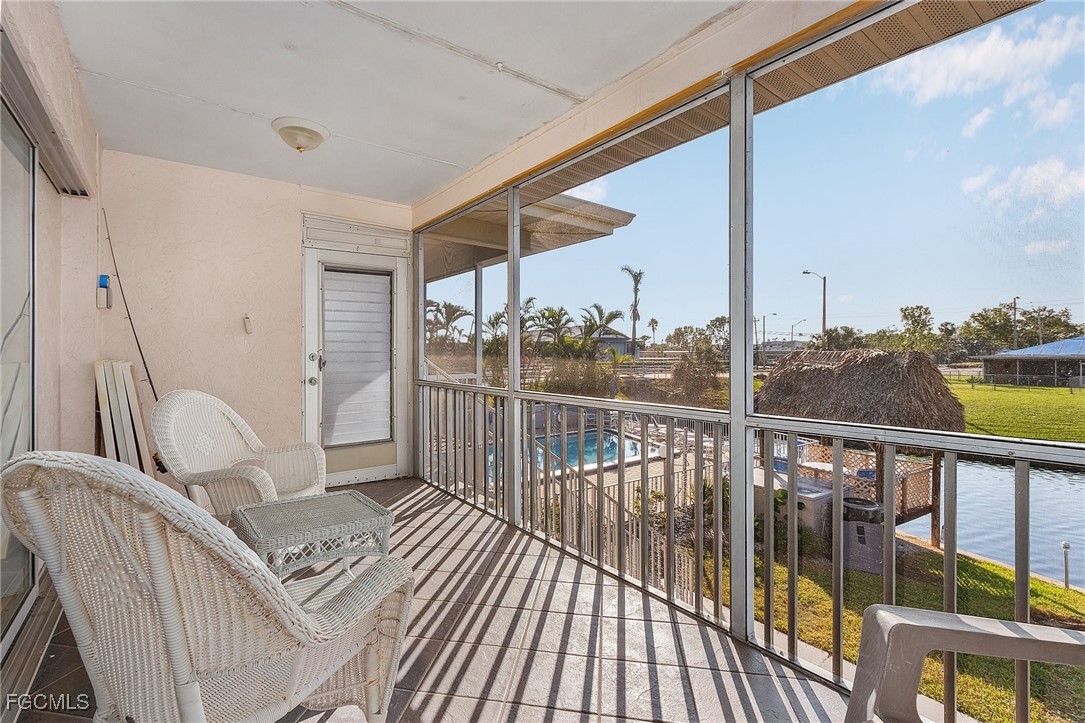 1120 Southeast 46th Street, Unit 2B Cape Coral, FL 33904 - Photo 22 of 26 a view of balcony with couch