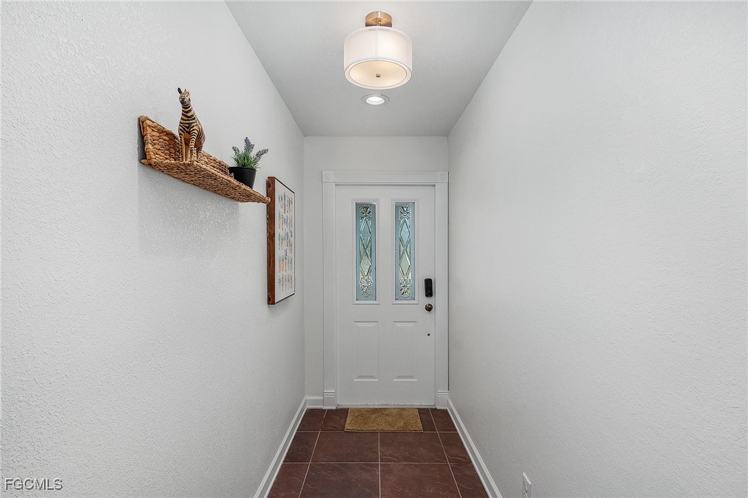 1120 Southeast 46th Street, Unit 2B Cape Coral, FL 33904 - Photo 3 of 26 a view of a hallway with closet