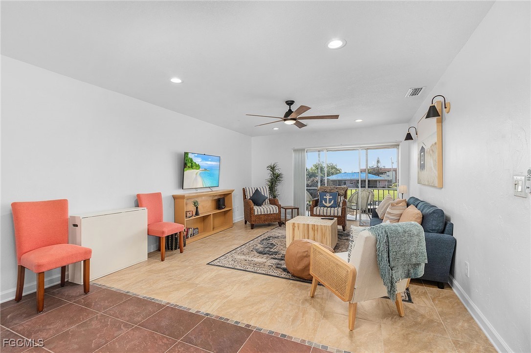 1120 Southeast 46th Street, Unit 2B Cape Coral, FL 33904 - Photo 4 of 26 a living room with furniture and a large window