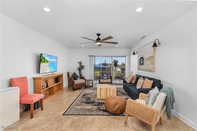 a living room with furniture and a rug