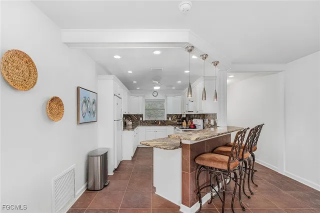 a kitchen with a table and chairs