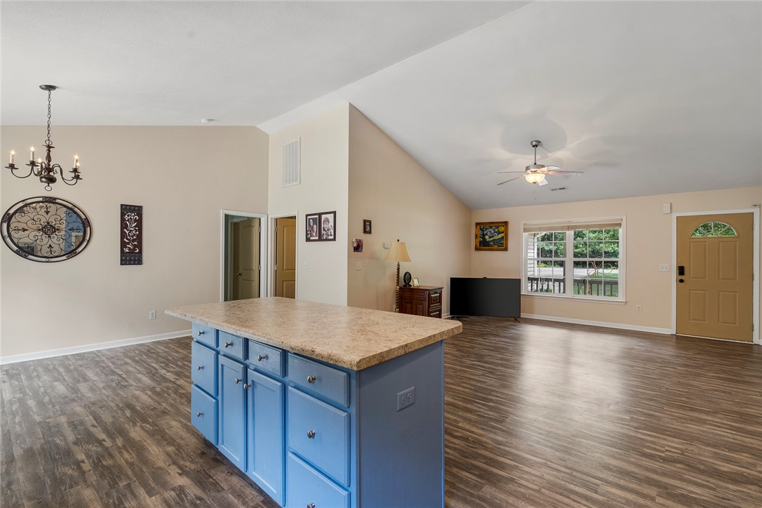 167 Mediterranean Avenue Anderson, SC 29621 - Photo 17 of 33 A versatile open-concept living space features lofty ceilings and durable wood flooring.