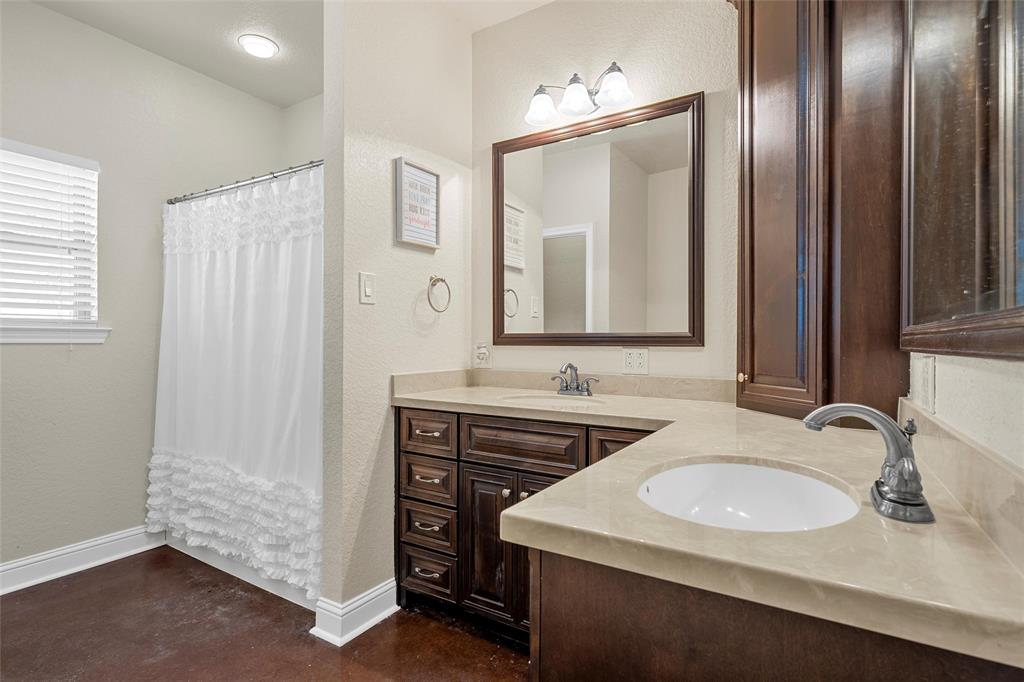 2743 Tokio Road West, TX 76691 - Photo 23 of 40 a bathroom with a sink and a mirror
