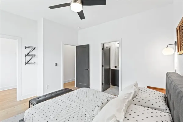 a bedroom with a bed and a dresser