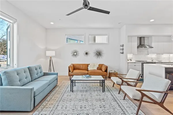 a living room with furniture and a rug
