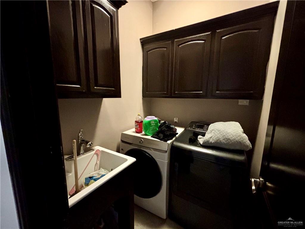 404 South Resplandor Street Mission, TX 78572 - Photo 16 of 19 a kitchen with a sink and a microwave