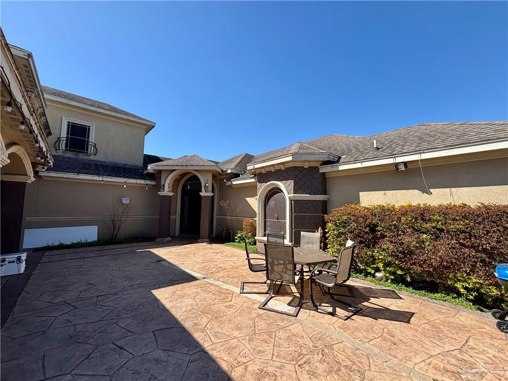 404 South Resplandor Street Mission, TX 78572 - Photo 2 of 19 a view of a chairs and table in backyard