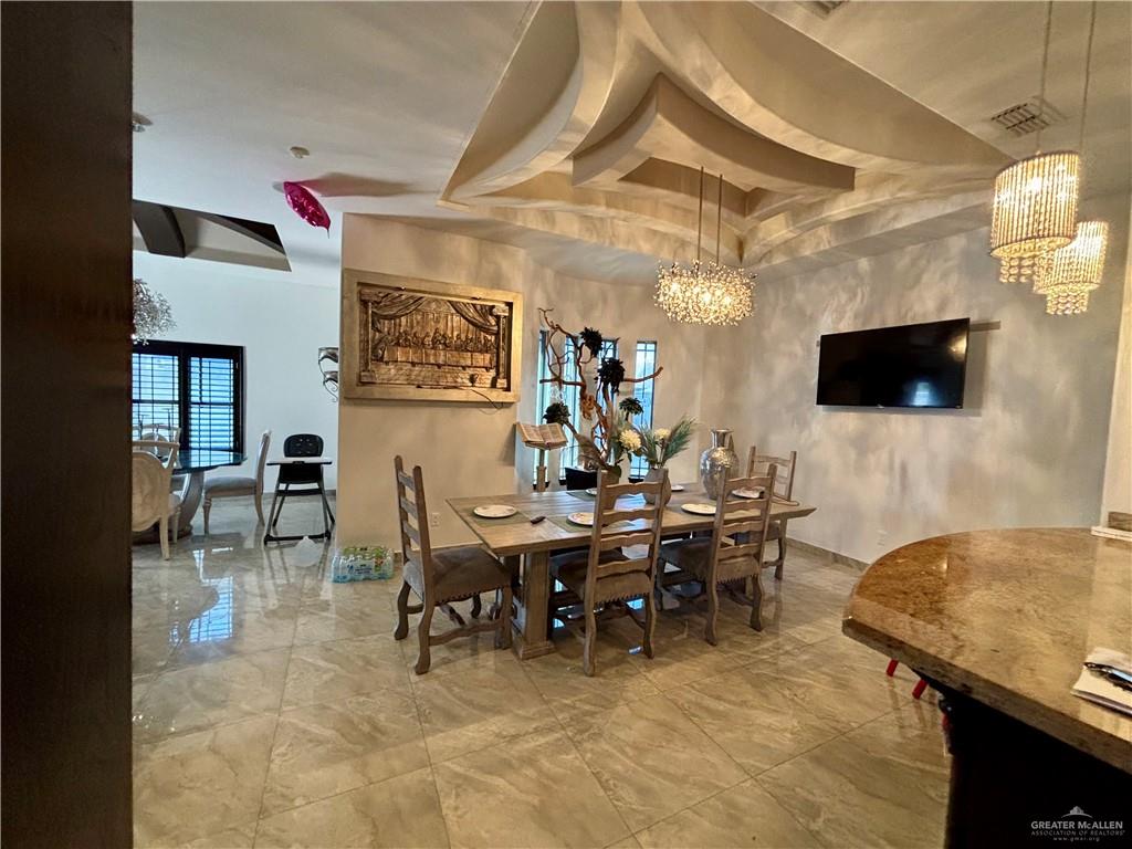 404 South Resplandor Street Mission, TX 78572 - Photo 7 of 19 a view of a livingroom with furniture and a flat screen tv