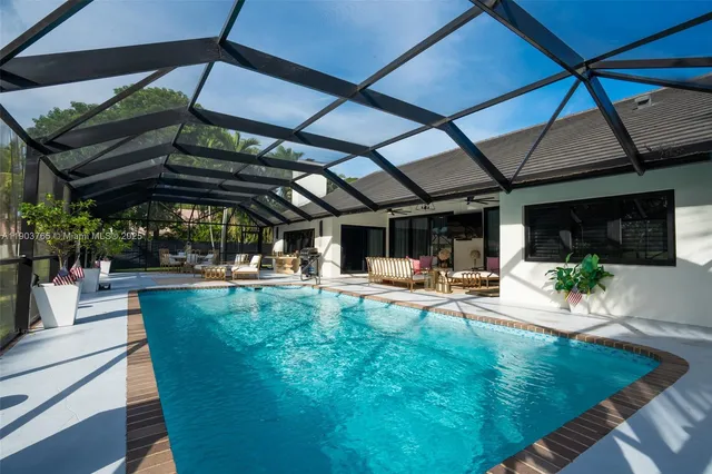 a view of a backyard with sitting area