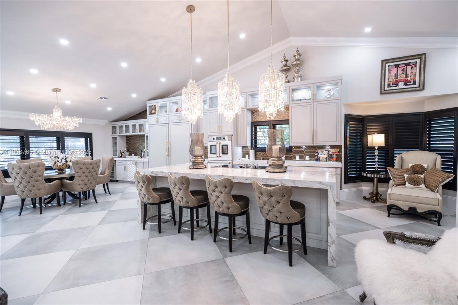 61 Northwest 128th Avenue Plantation, FL 33325 - Photo 2 of 24 a large dining space with furniture and a large window