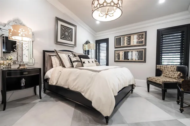 a bed room with a bed and a chair