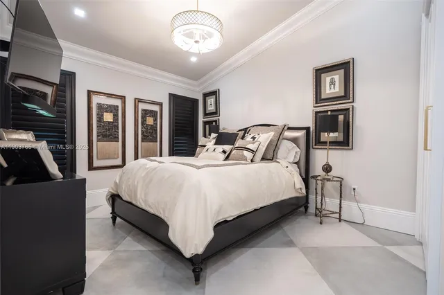 a bedroom with a large bed and tv