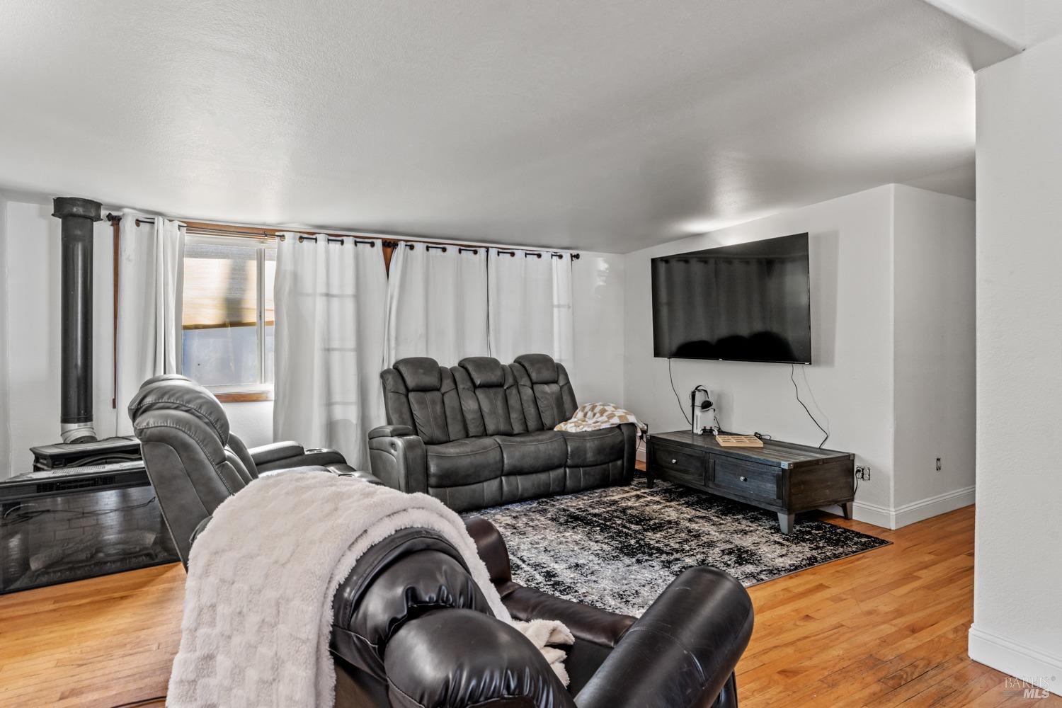2901-2903 Rd I, Unit AC Redwood Valley, CA 95470 - Photo 24 of 31 Living room with fireplace.