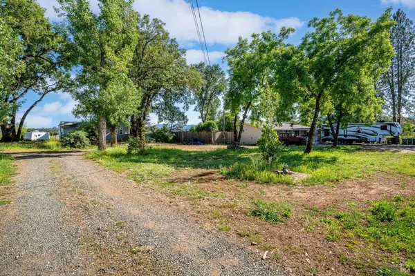 a view of a livingroom with wooden floor and a window