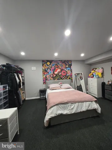 a bedroom with a bed and walk in closet