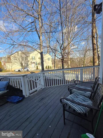 a view of a chairs on wooden deck