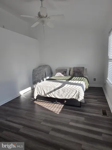 a bedroom with bed and window