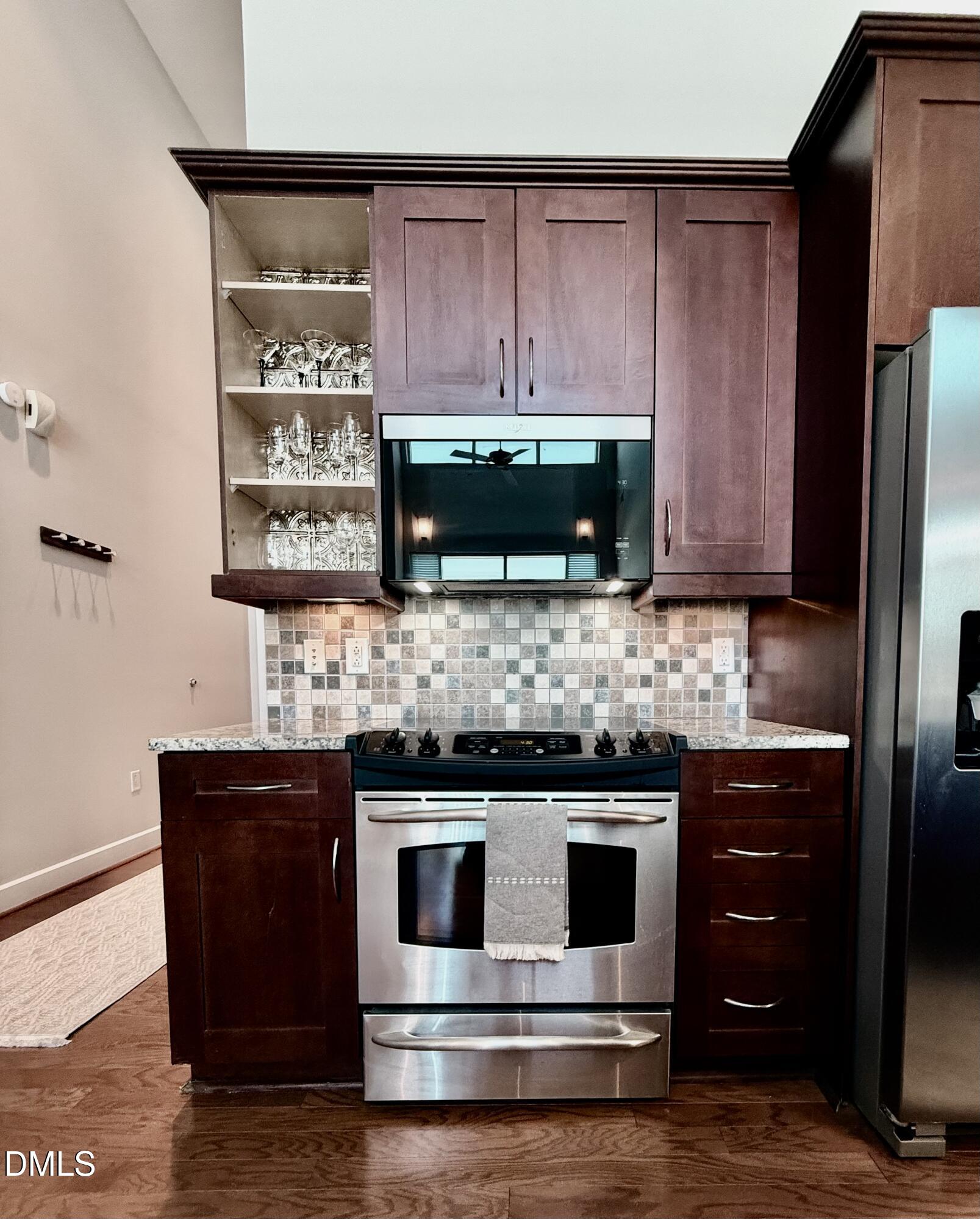 2608 Erwin Road, Unit 421 Durham, NC 27705 - Photo 12 of 45 a kitchen with stainless steel appliances wooden cabinets and a counter top space