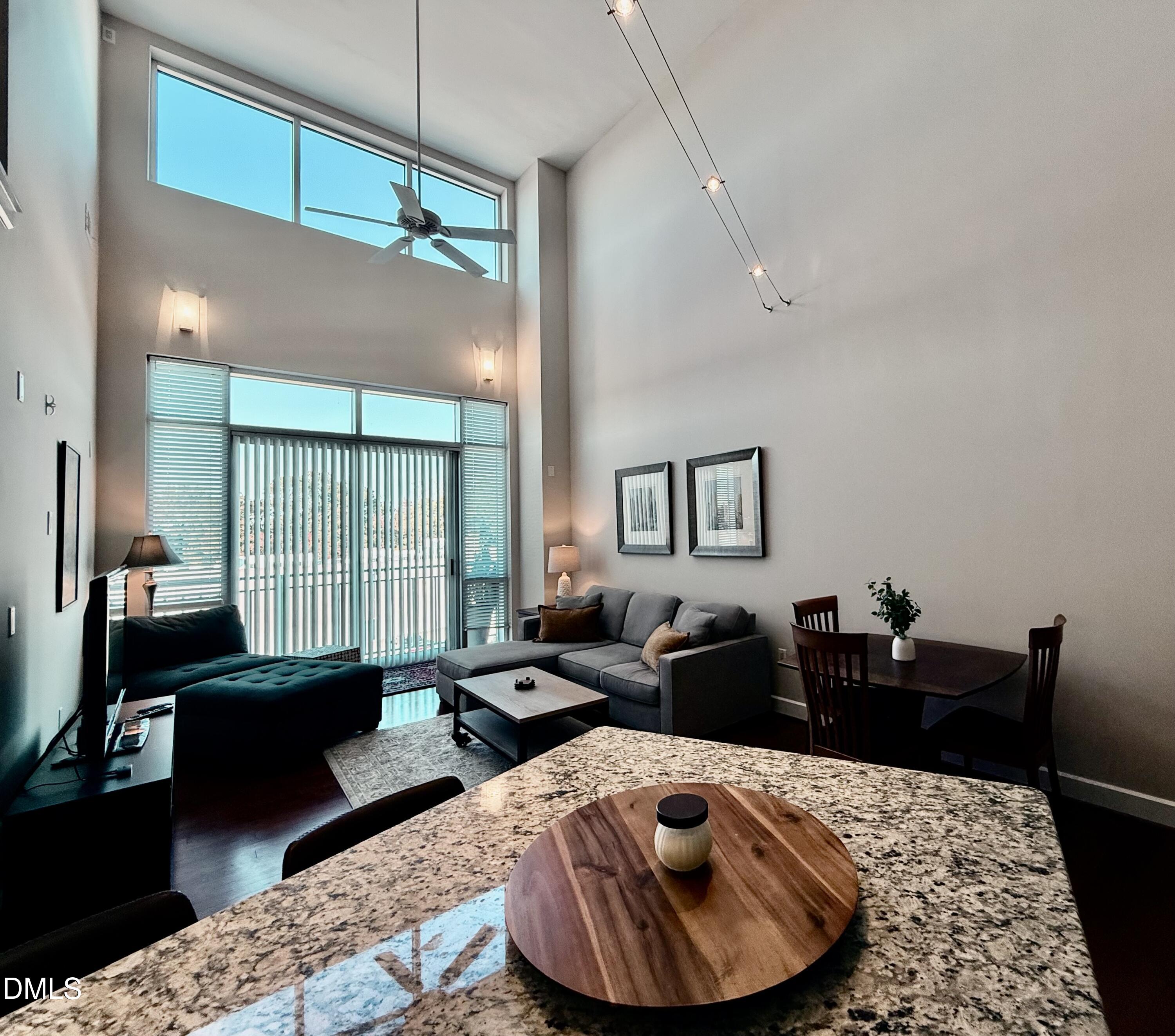 2608 Erwin Road, Unit 421 Durham, NC 27705 - Photo 16 of 45 a living room with furniture and a large window