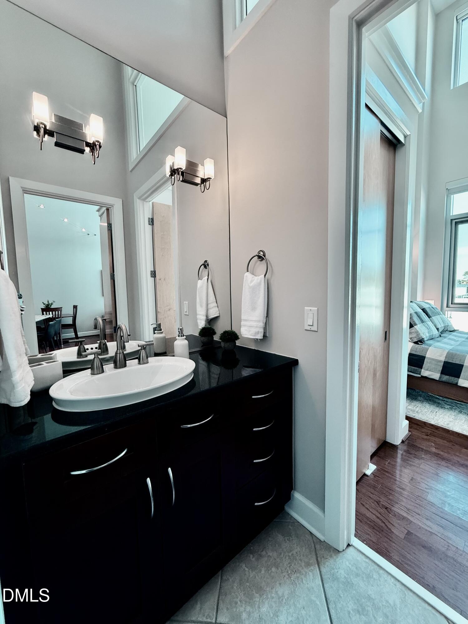 2608 Erwin Road, Unit 421 Durham, NC 27705 - Photo 24 of 45 a bathroom with a double vanity sink and a mirror