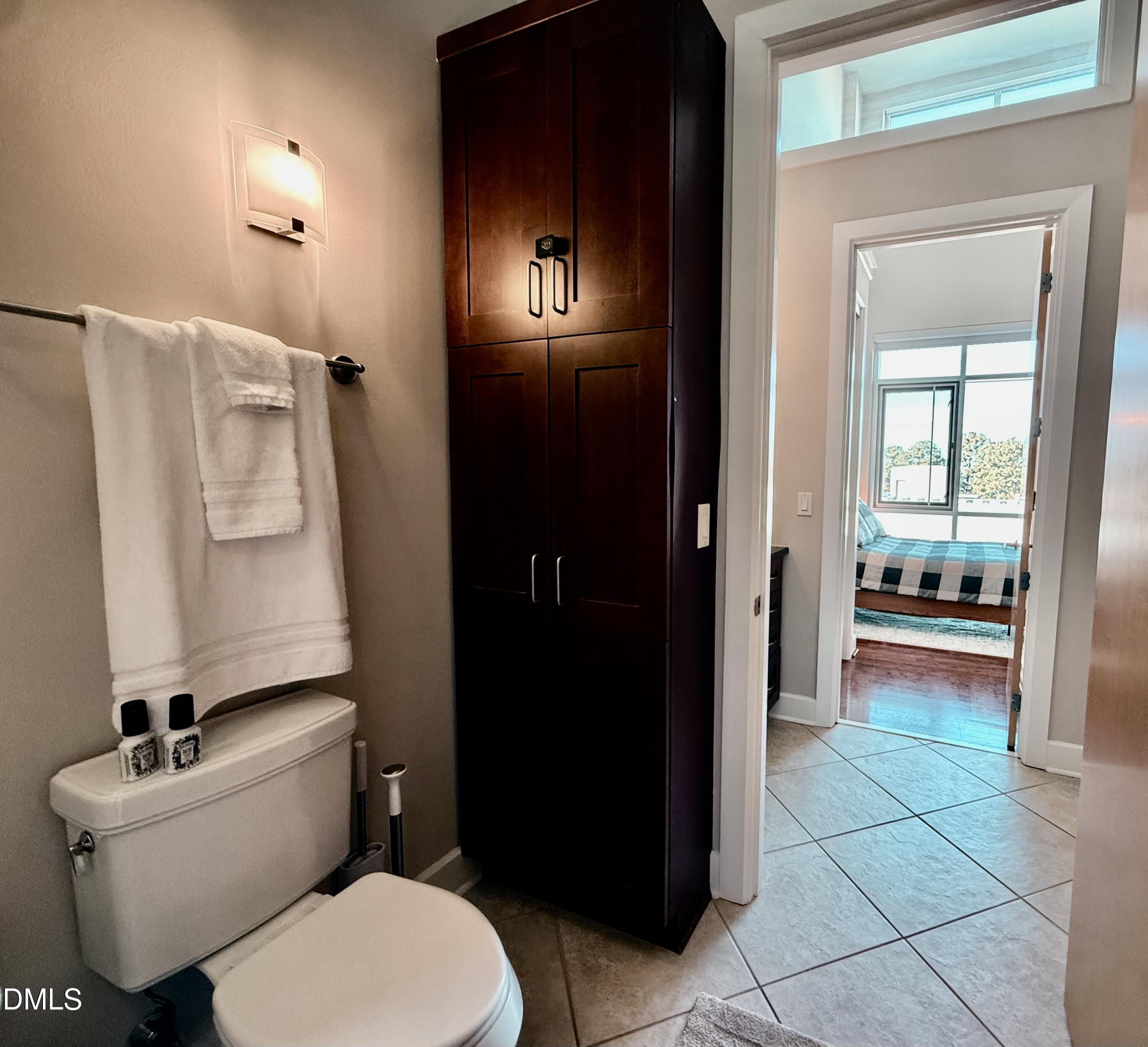 2608 Erwin Road, Unit 421 Durham, NC 27705 - Photo 26 of 45 a bathroom with a toilet sink and shower