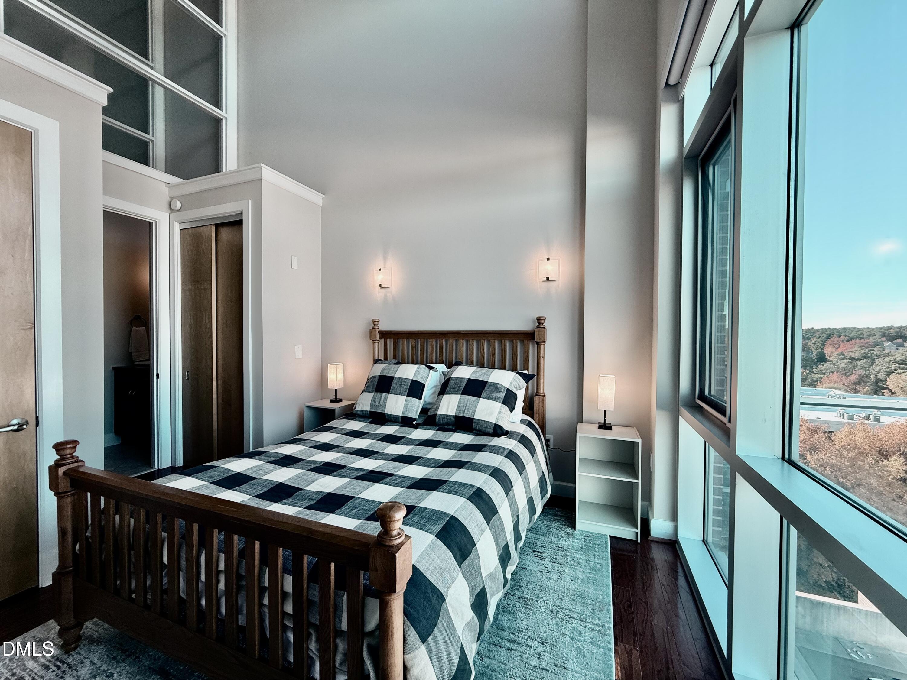 2608 Erwin Road, Unit 421 Durham, NC 27705 - Photo 32 of 45 a bed sitting in a bedroom next to a window