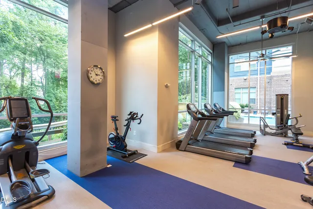a view of a swimming pool with outdoor seating