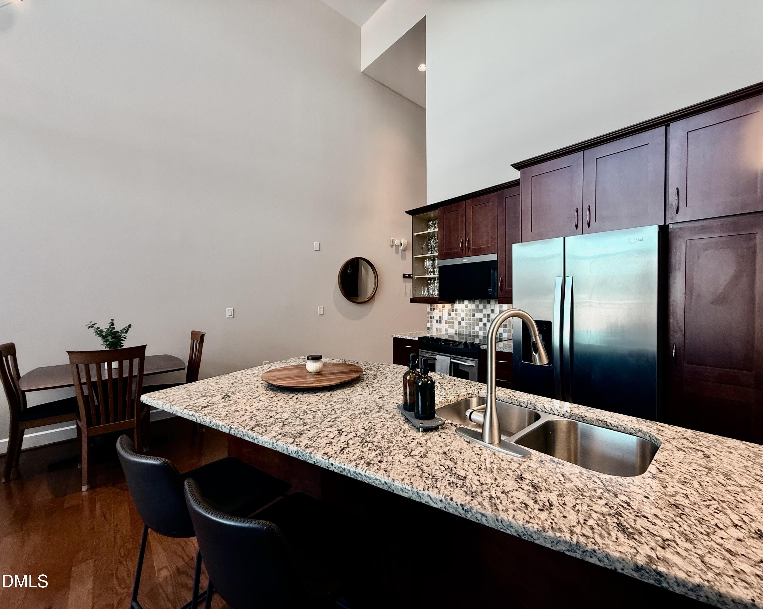 2608 Erwin Road, Unit 421 Durham, NC 27705 - Photo 10 of 45 a kitchen with granite countertop a sink and a refrigerator