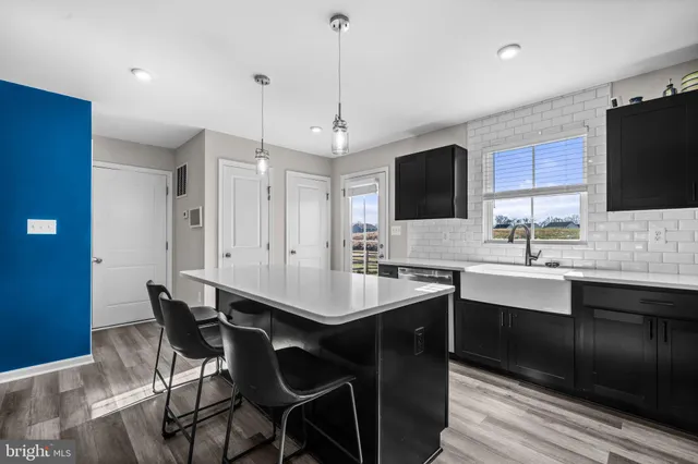 a bedroom with a bed a desk and chair