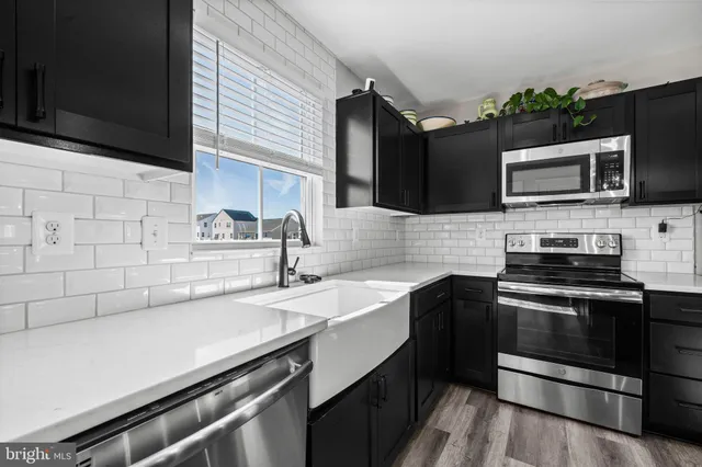 a bedroom that has a bed and a desk