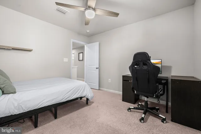 a work room with furniture and windows