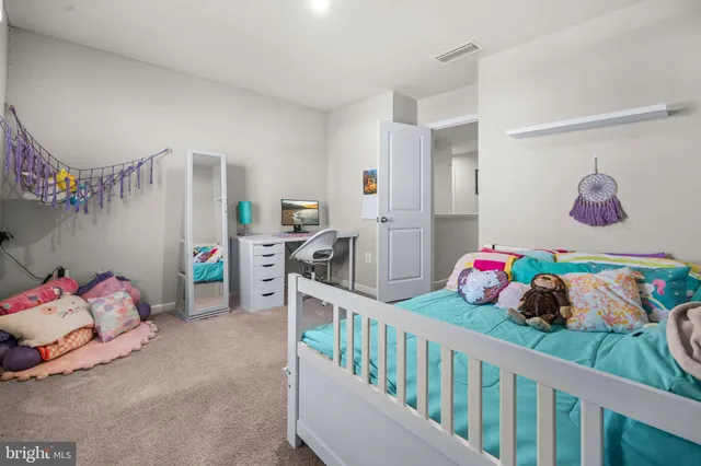 a bathroom with a double vanity sink toilet and shower