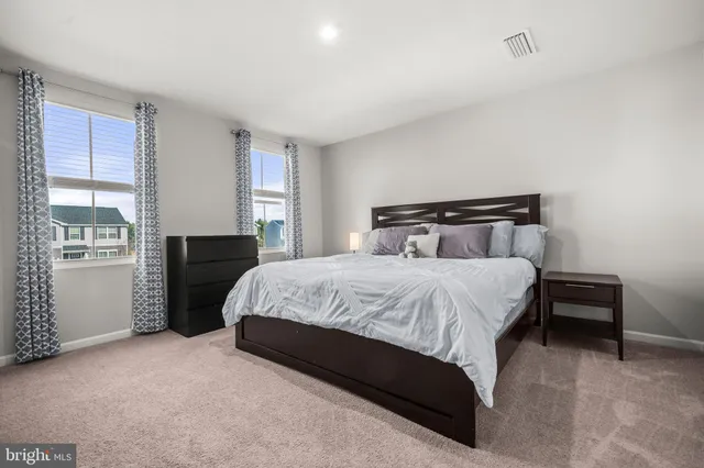 a view of swimming pool with outdoor seating and yard in back