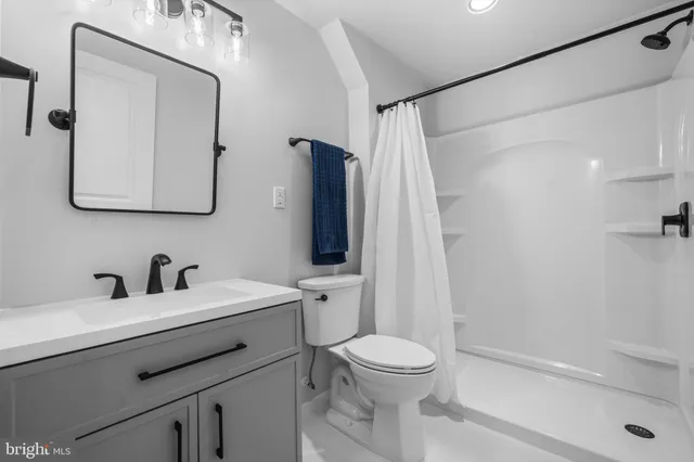 an aerial view of a house with outdoor space