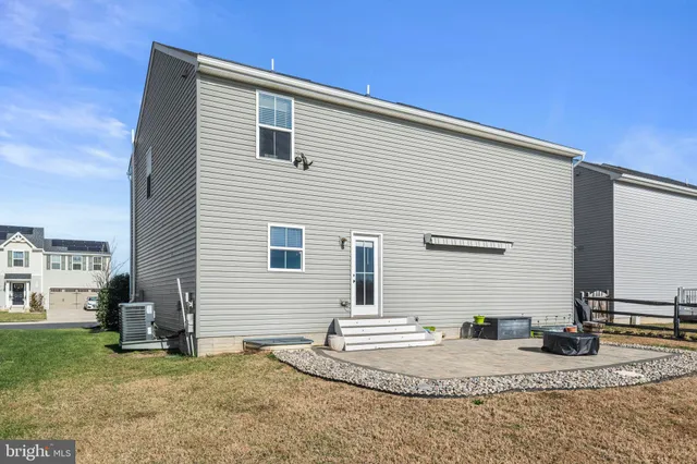 a front view of a house with yard